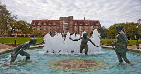 statue of children playing in fountain